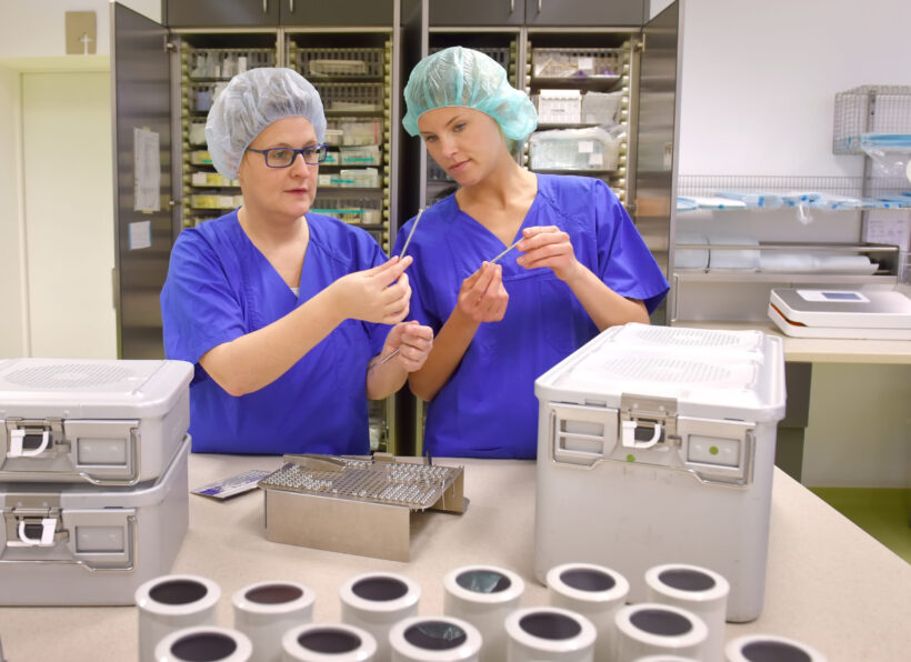 Two women are seen working as medical hygiene 
workers. They are dressed in medical hygiene 
clothing. They are seen carrying out hygiene 
disinfecting and sterilization tasks.