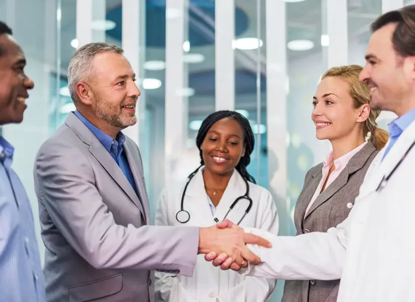 Happy business people and doctors came to an agreement.